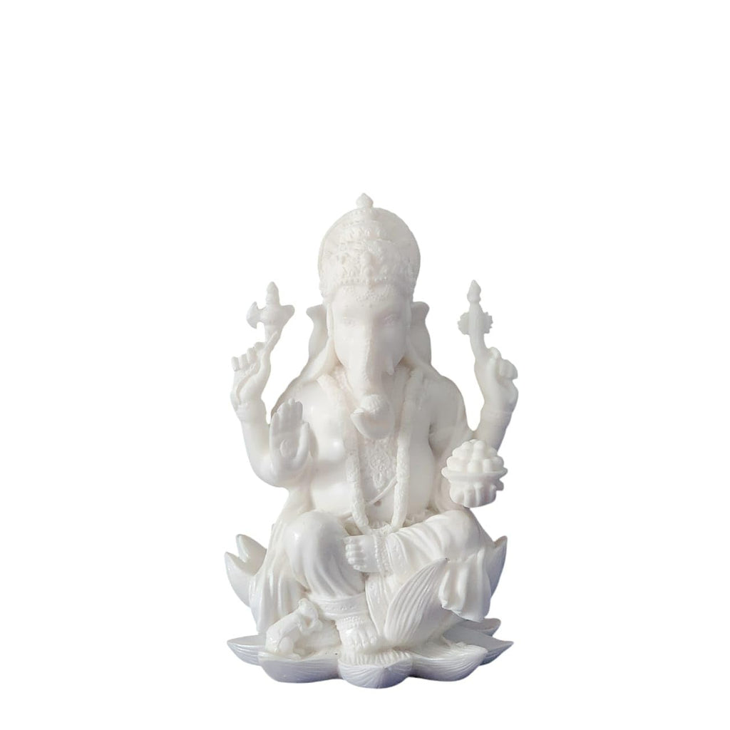 White statue of a seated figure with a lotus flower on a white background