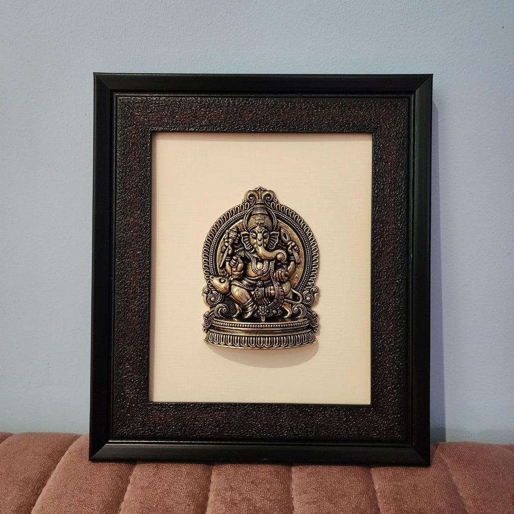 Framed decorative wall art with a religious icon on a beige background