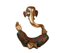 Decorative statue of a mythical creature with intricate designs on a white background
